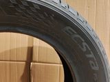 a close up of a tire with a box in the background