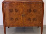 an image of a wooden cabinet with two doors and two drawers