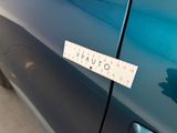 a sticker on the door of a car that says vauto