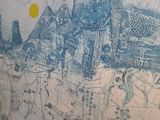 a drawing on the wall of a building with a sun in the background