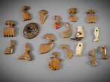 an image of a collection of wooden animal figurines on a gray surface