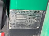 a close up of a green gas pump with the numbers on it