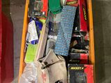 a box full of assorted items sitting on the floor