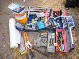 a lot of tools that are laying out on the ground