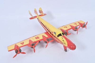 underside view of a red and yellow model of a plane on a white surface