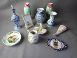 a lot of small vases and plates that are on a table