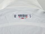 a close up of a white shirt with a label on it