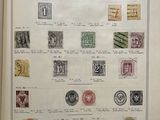 an old book with a bunch of stamps on it
