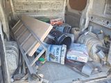 the back of a van with a bunch of items in the back