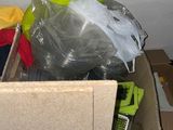 a box full of items that are sitting on the floor