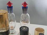 many different types of perfume bottles on the table