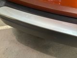 a close up of a car ' s bumper with a sticker on it