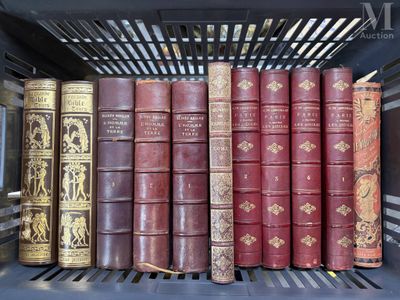 several old books are lined up on a shelf in a library