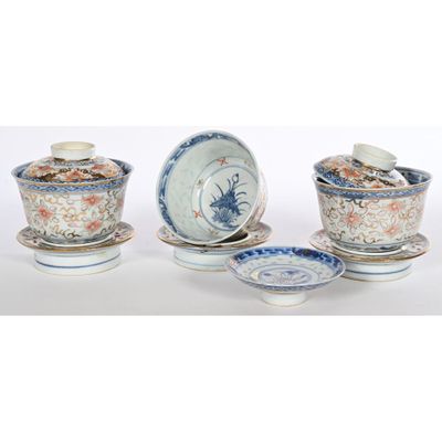 several different types of dishes and saucers on a white surface