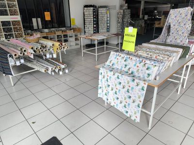 a room filled with lots of different types of fabrics