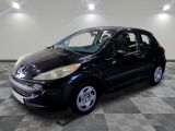 a picture of a small black car in a showroom