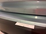 a picture of a car with a sticker on it ' s hood