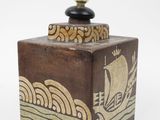 a small wooden box with a lamp on top of it