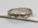 a close up of a ring on a stick with a stick in the background