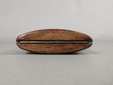 a close up of a wooden object on a table