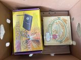 two books in a cardboard box on the table