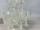 a lot of wine glasses sitting on a table