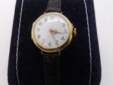 a watch that is sitting on top of a velvet case