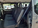 the back seats of a van are empty in the parking lot