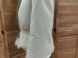 an image of a coat on a mannequin stand