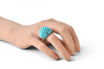 a close up of a person ' s hand with a ring on it