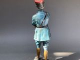 figurine of a man with a red hat and a blue suit