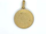 a close up of a gold coin on a white surface