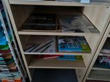 a book shelf that has many books on it