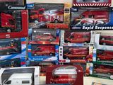 many different types of toy trucks and trucks on the table