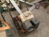 a lawn mower that is sitting on the ground