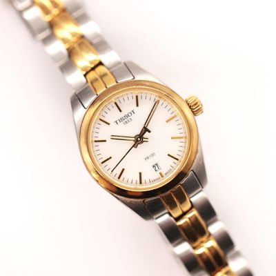an image of a close up of a wrist watch on a white surface