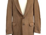 the jacket is brown and has buttons on the front of it