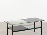 une photo d'une table basse en verre avec des pieds noirs et un plateau en verre