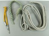 a rope and a crochet hook on a table