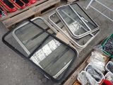 many different types of windows sitting on a pallet