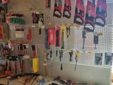a workbench with many tools on it in a room