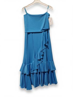 the blue dress is hanging on a hanger on a white wall