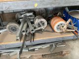 a pile of tools sitting on a shelf in a garage