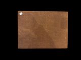 a piece of brown paper with a white tag on it