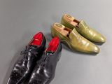 three pairs of shoes are lined up on a table