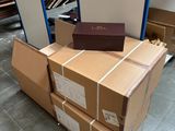 a stack of boxes sitting on the floor in a warehouse