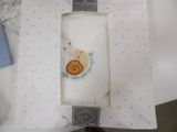 a picture of a snail in a box on a table