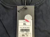 the back of a black jacket with a label on it