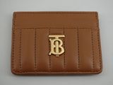 un portefeuille en cuir marron orné d'un logo monogramme sur le devant