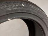 a close up of a tire on a white surface